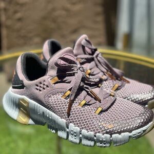 Nike Purple and Gold Athletic Shoes with Flexible Sole